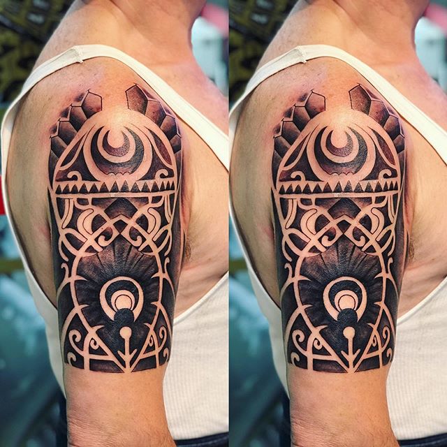 Tribal tattoo on the right shoulder