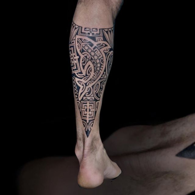 Tribal tattoo on the left calf