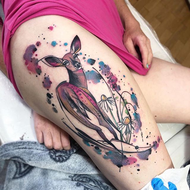 Watercolor tattoo of a deer on the right thigh