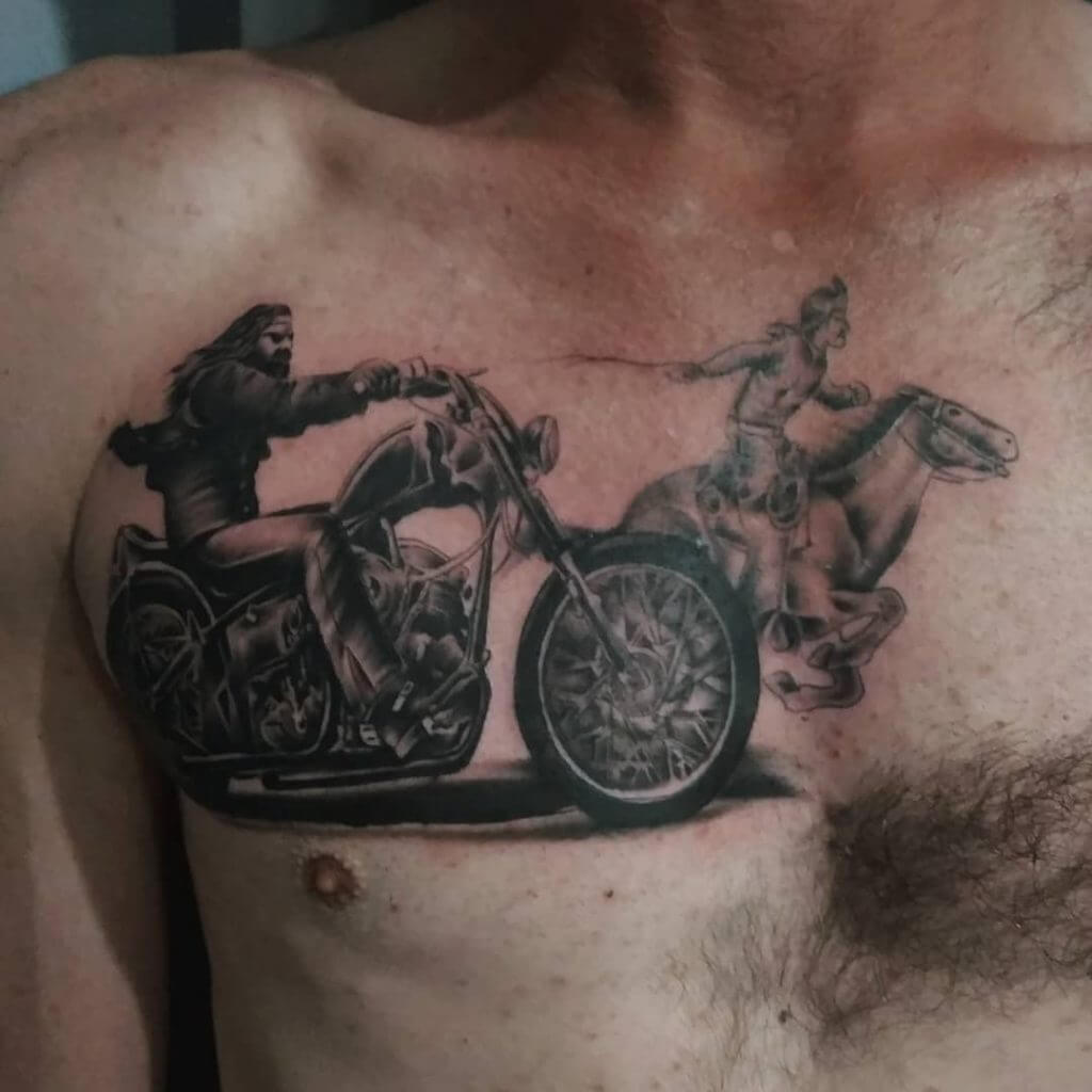Mens motorbike tattoo of a biker and an Indian on the horse, on the chest