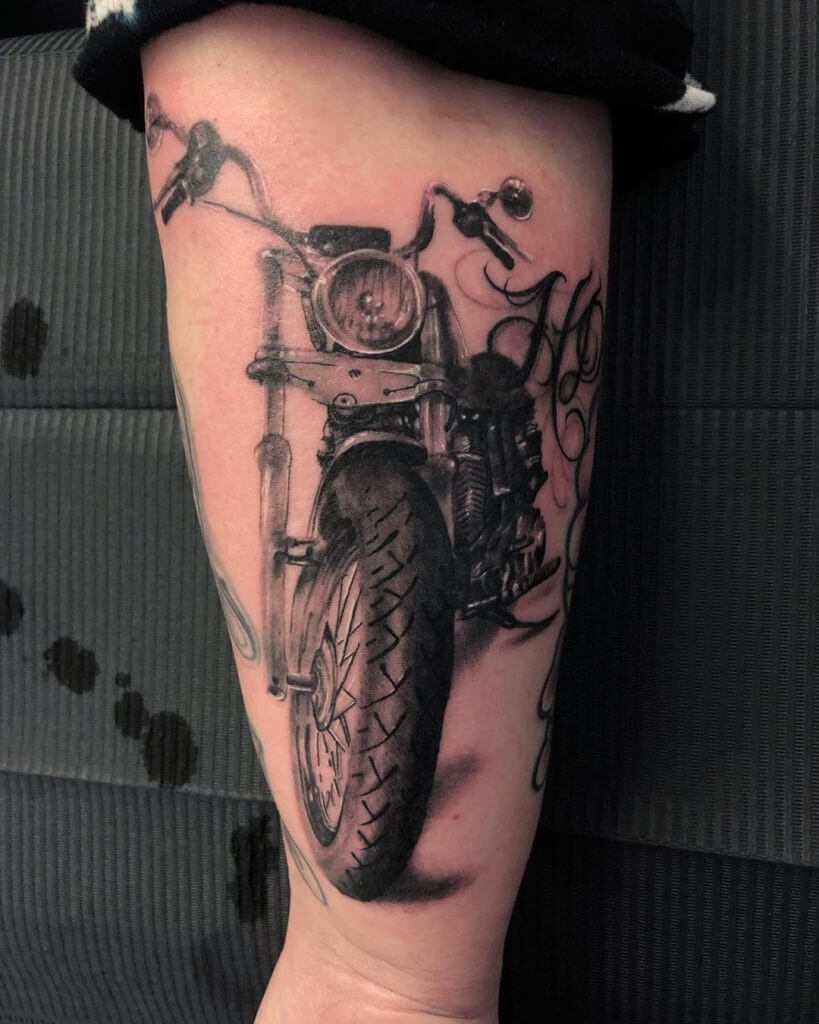 Mens motorbike tattoo of a bike on the right forearm