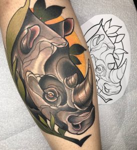 Color Animal tattoo of a rhino on the calf