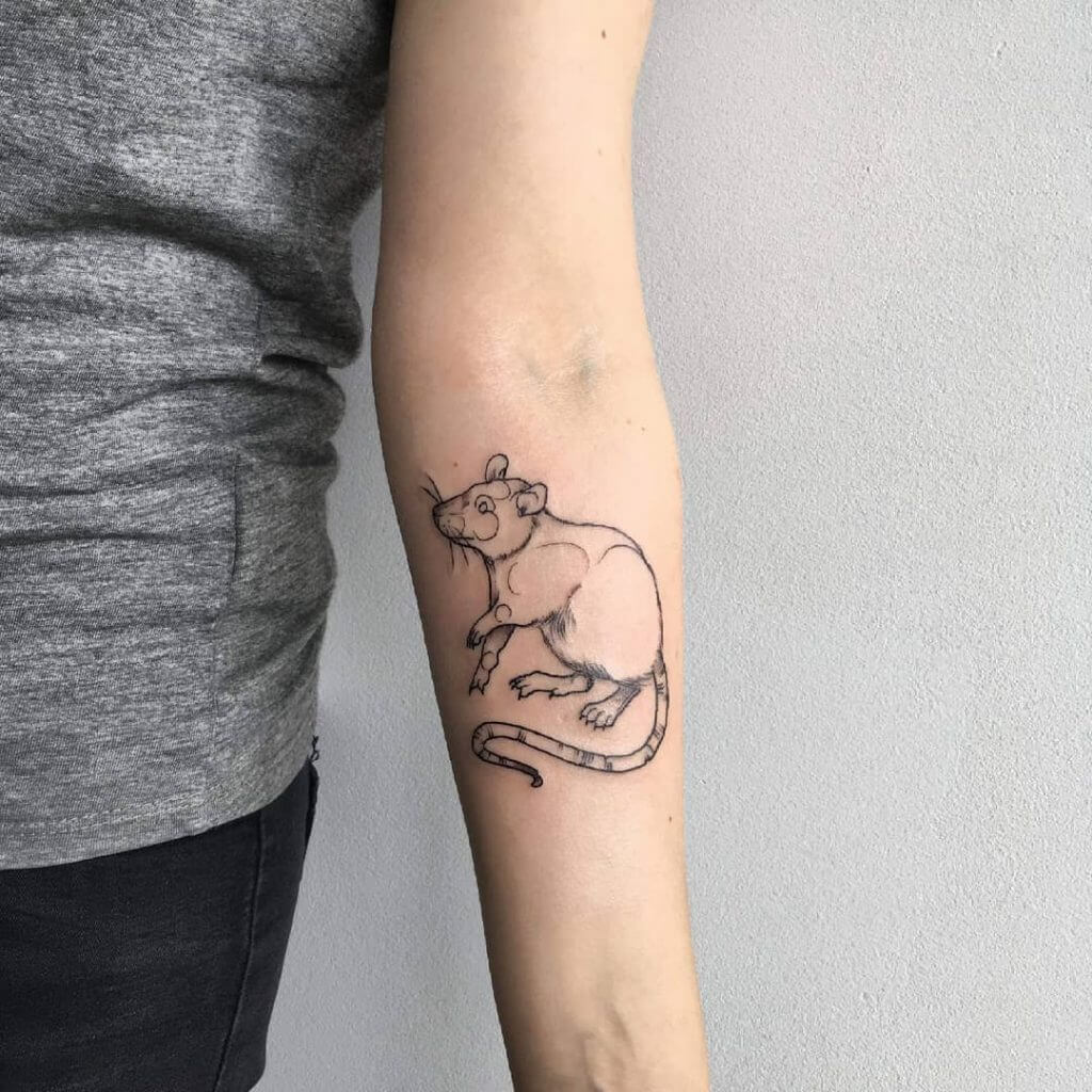 Black Animal tattoo of a rat on the right forearm