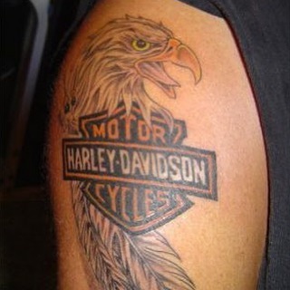 Mens motorbike tattoo of the Harley Davidson mark and eagle on the right shoulder