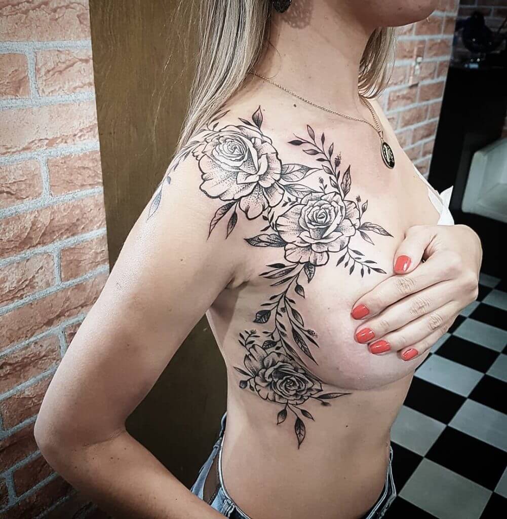 Black Flowers tattoo on the right shoulder and ribs