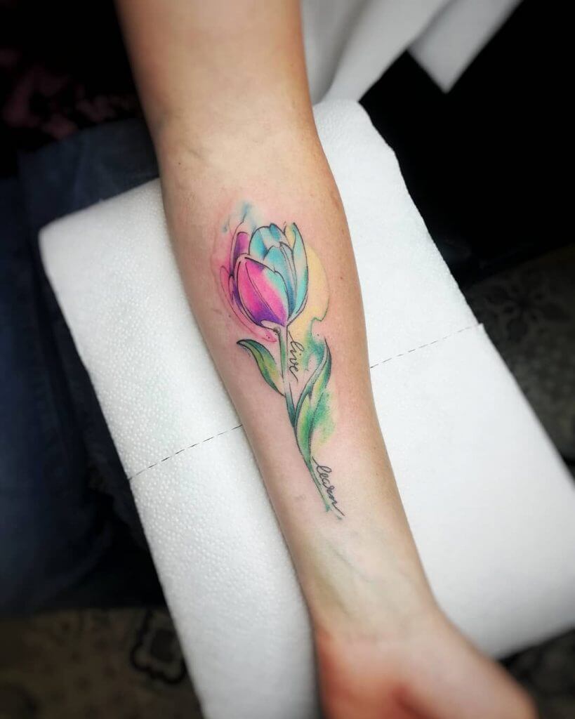 Watercolor Flowers tattoo on the left forearm