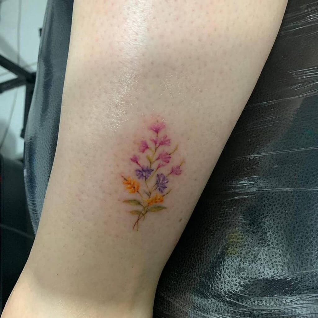 Color Flowers tattoo on the foot