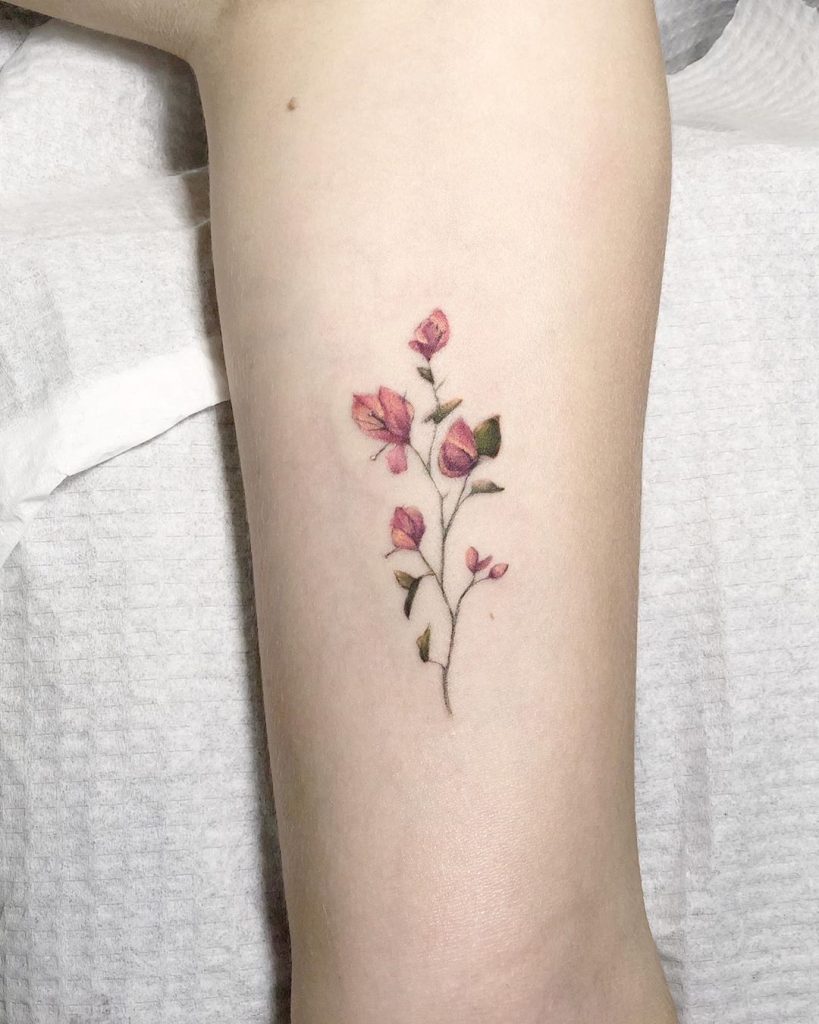 Color Flowers tattoo on the left forearm