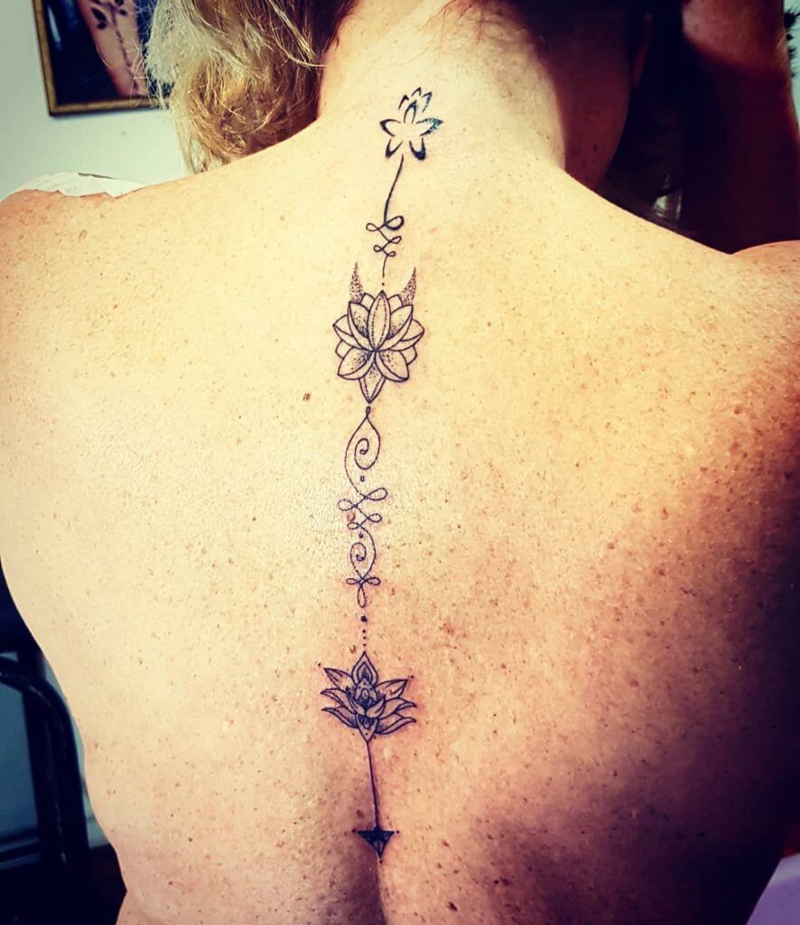 Black Flowers tattoo on the back