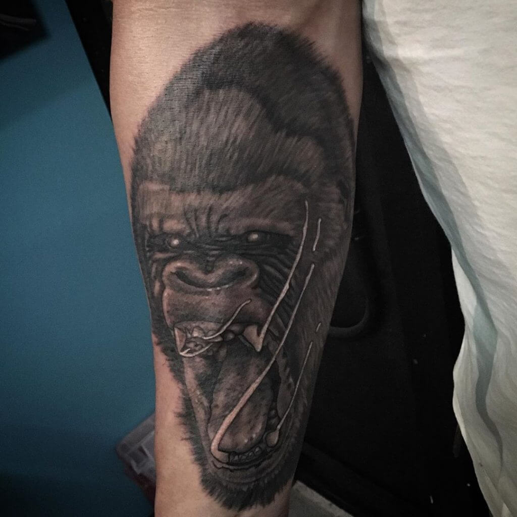 Black Animal tattoo of a gorilla on the right arm