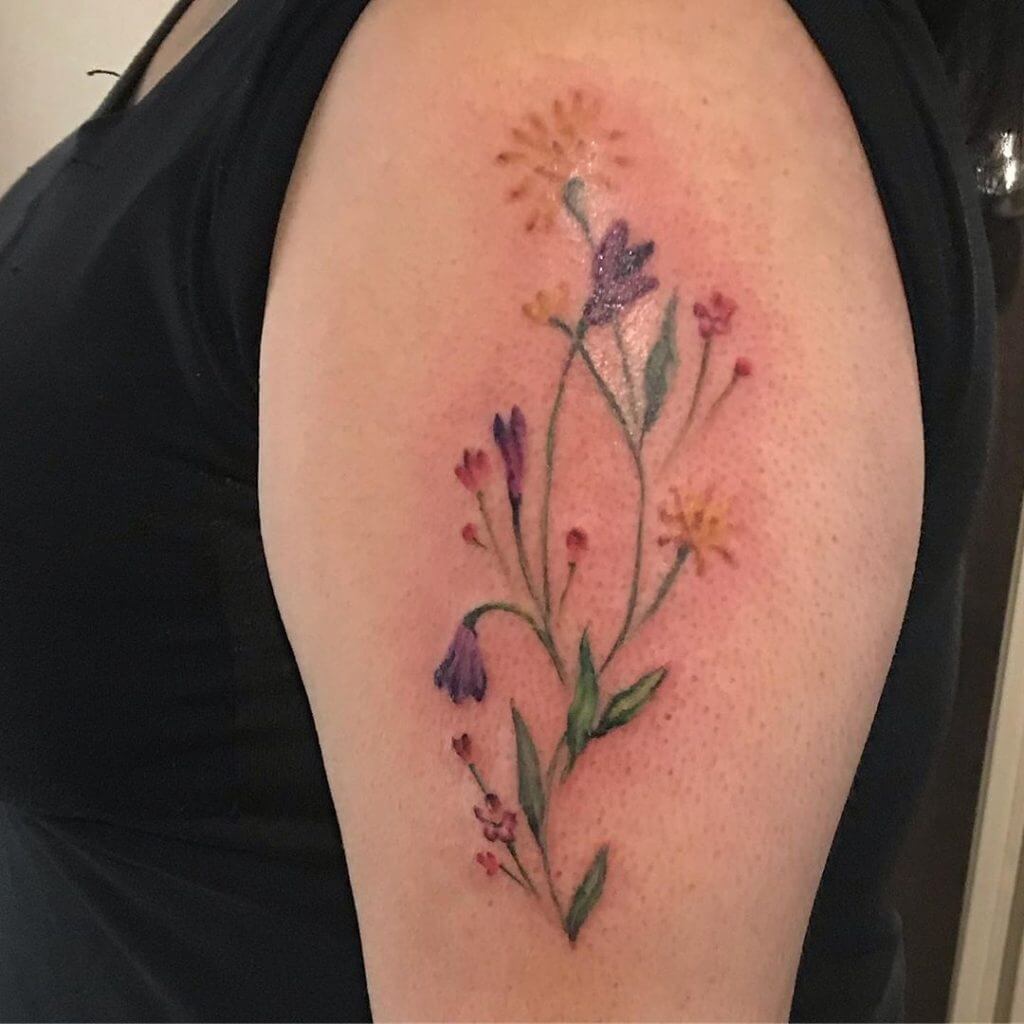 Color Flowers tattoo on the left arm