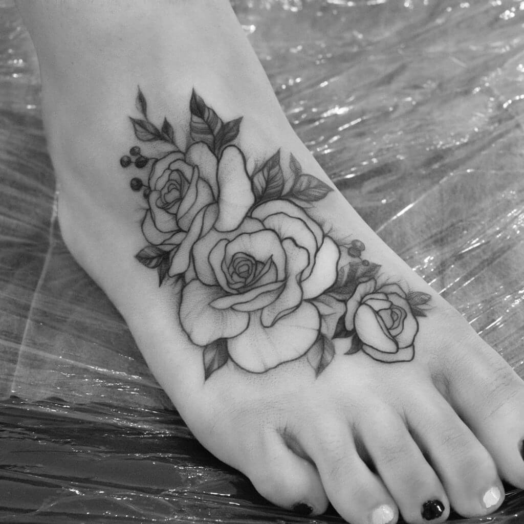 Black Flowers tattoo on the right foot