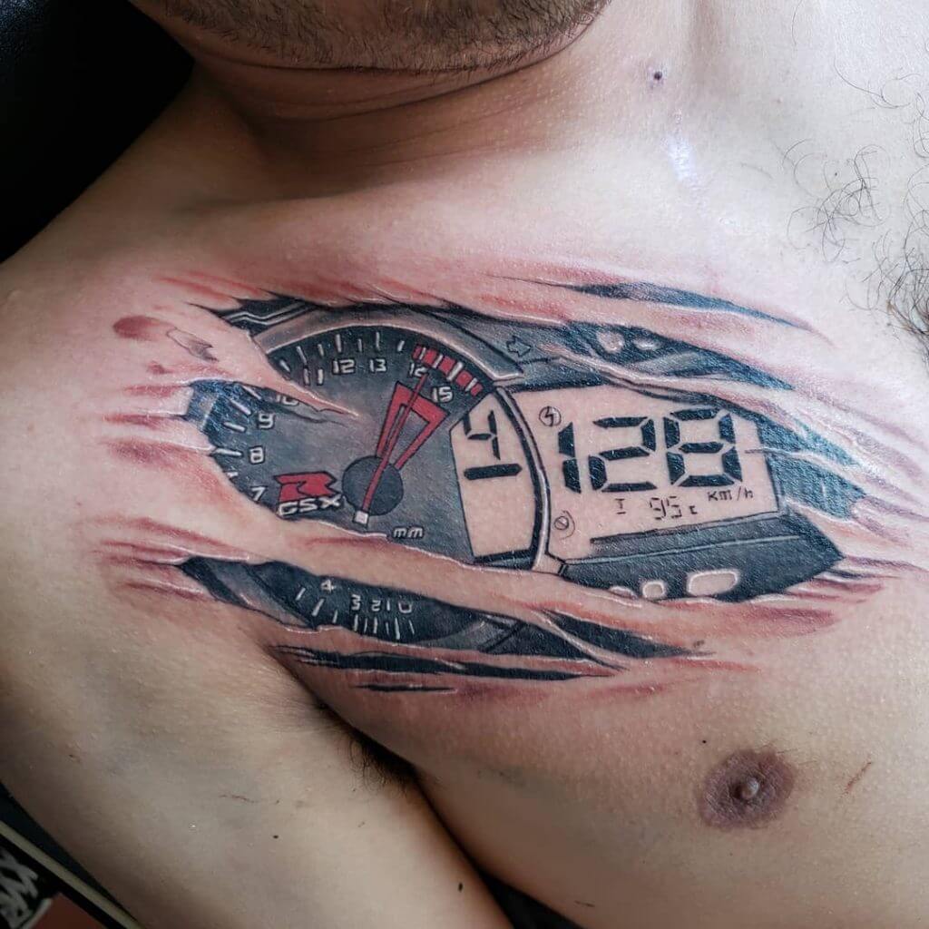 Mens motorbike tattoo of a bike speedometer, on the right collar bone