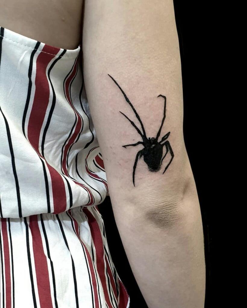 Black Animal tattoo of a spider on the right arm