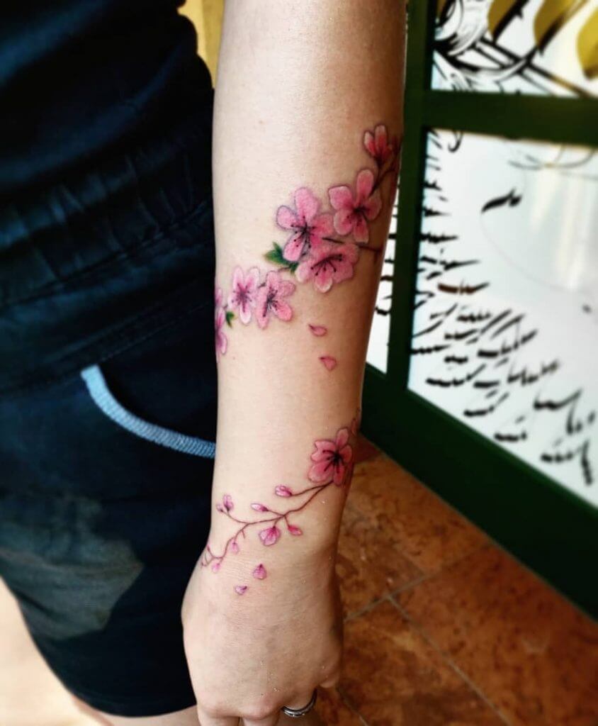 Color Flowers tattoo on the left forearm