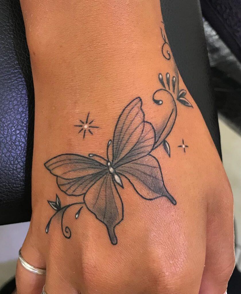 Black Butterfly tattoo on the right hand