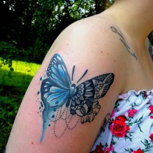 Butterfly tattoo on the right shoulder