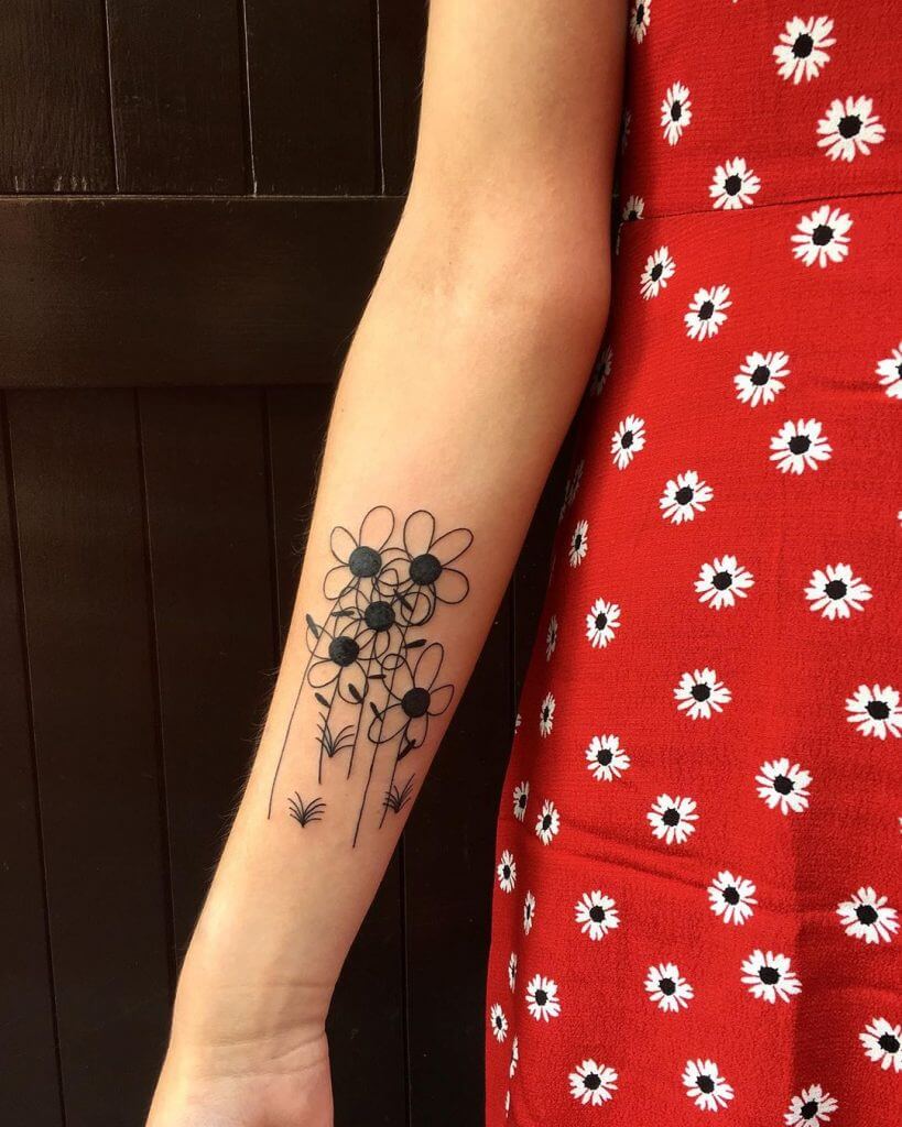 Black Flowers tattoo on the right forearm