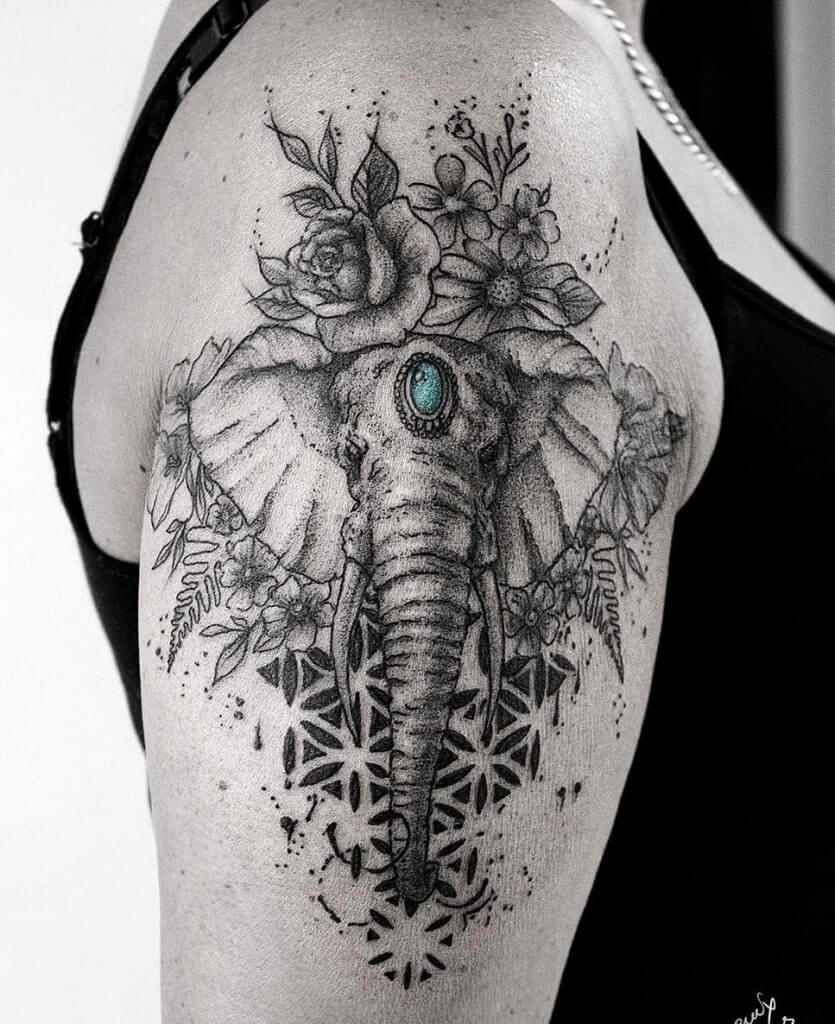 Dotwork Animal tattoo of an elephant and roses on the right arm