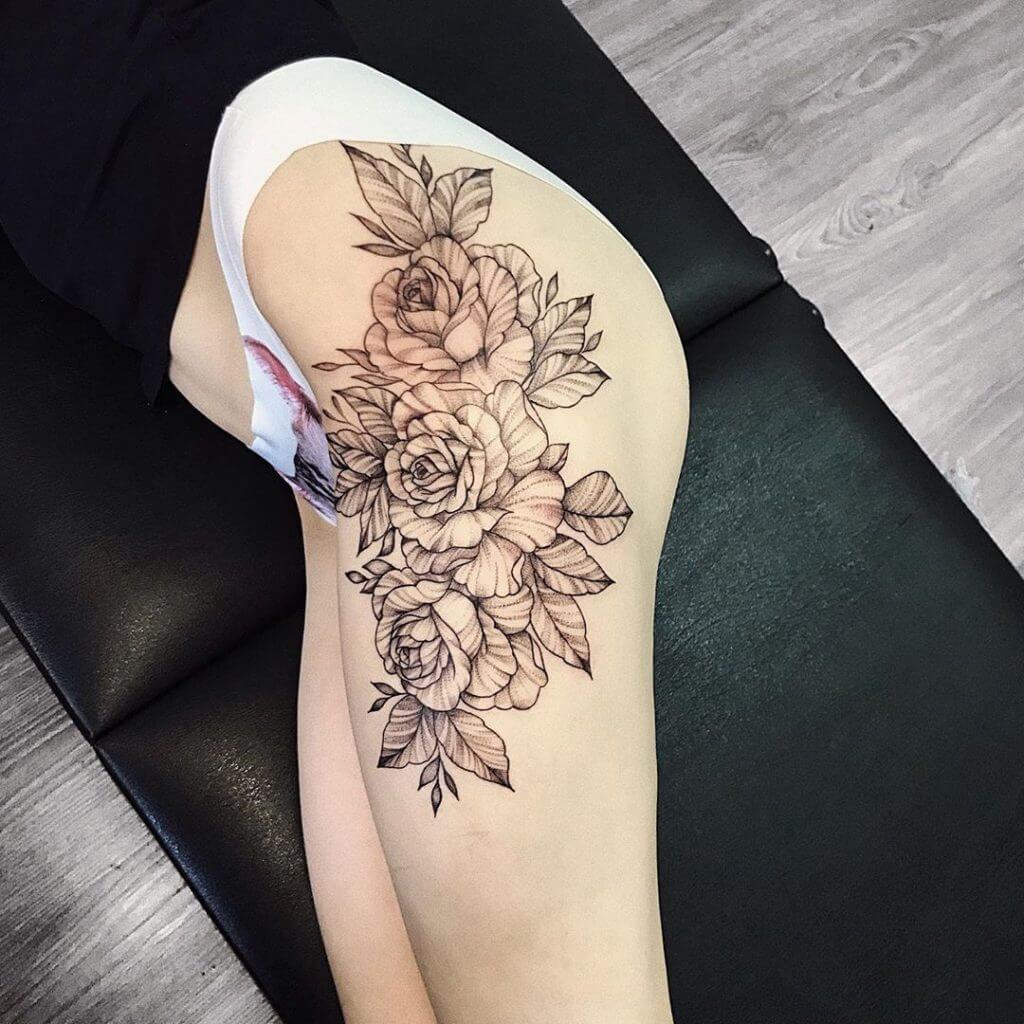 Black Flowers tattoo on the left thigh