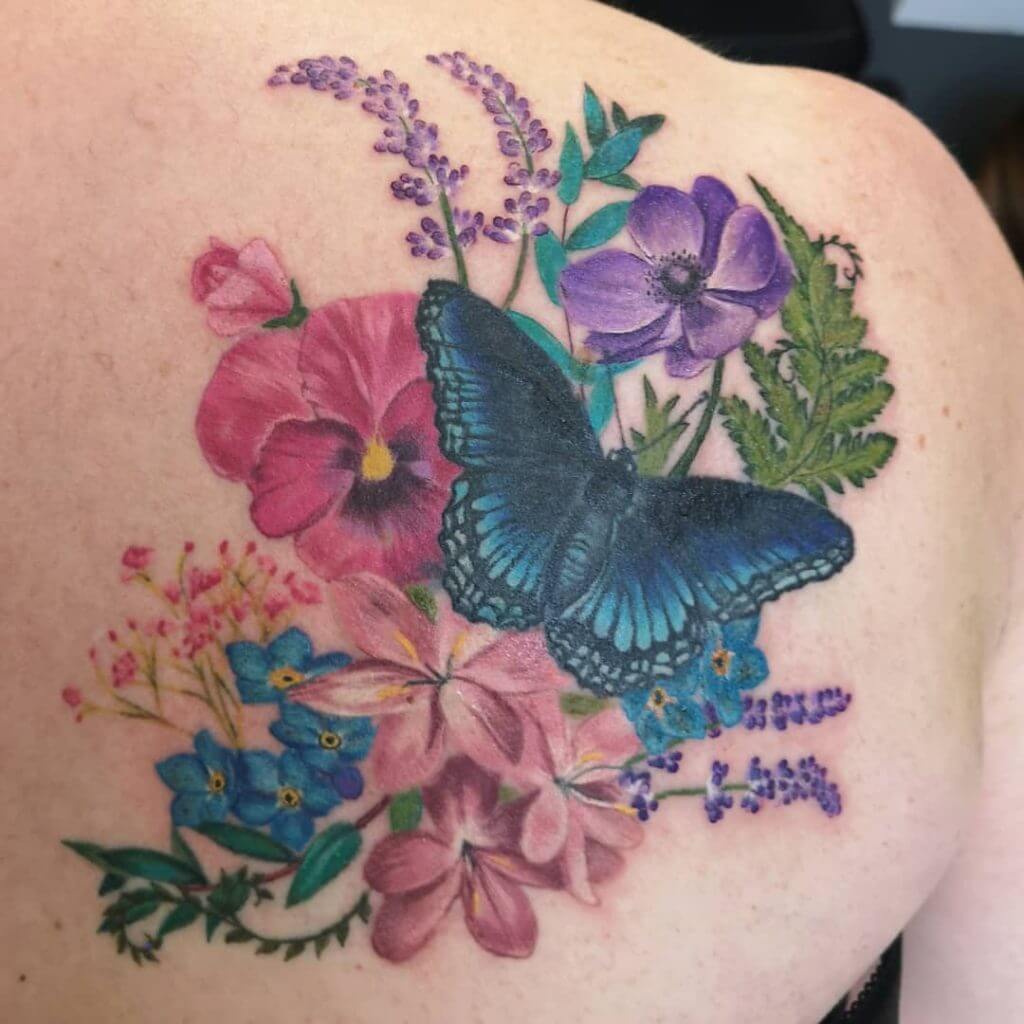 Color Butterfly tattoo with flowers on the back