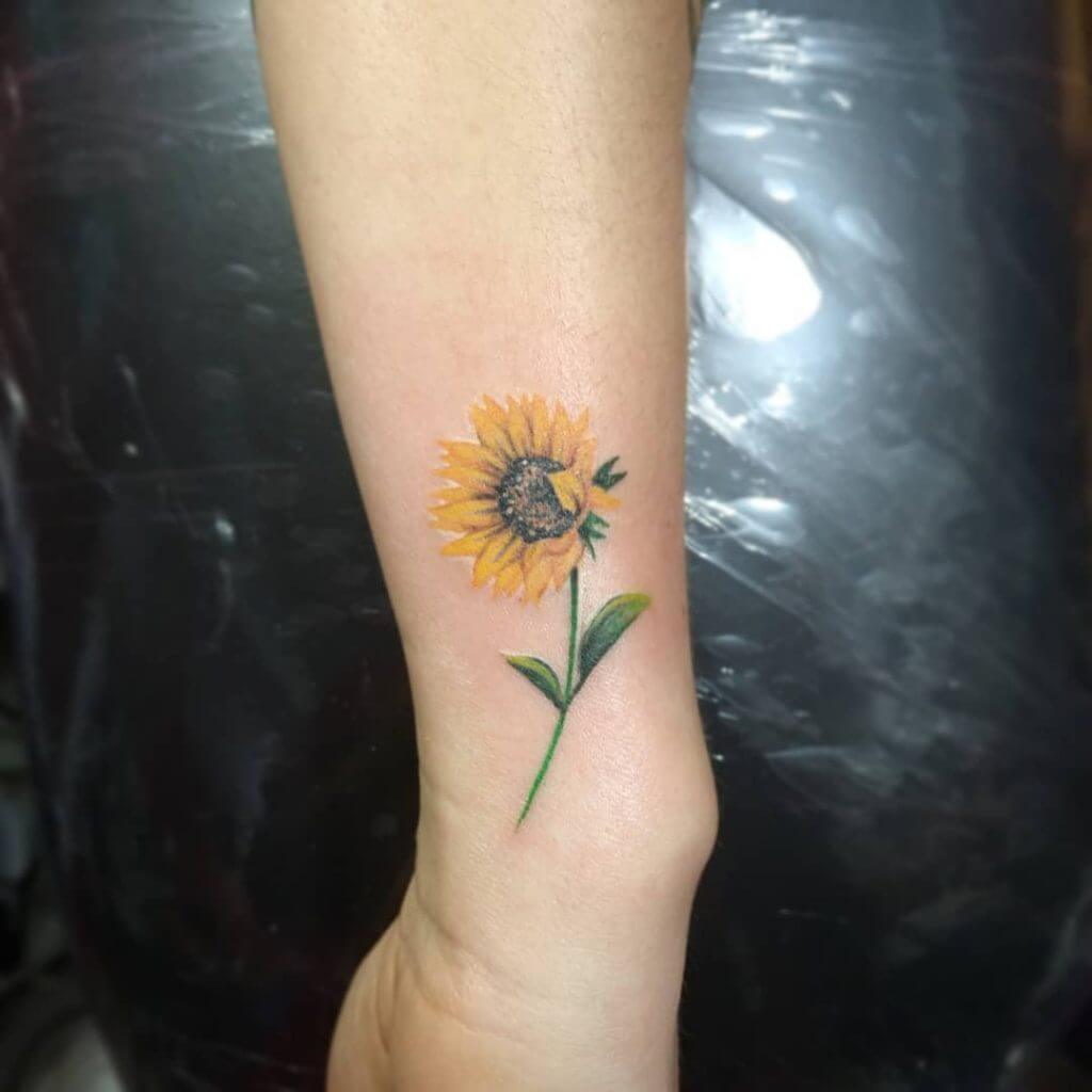 Color Flowers tattoo on the right forearm