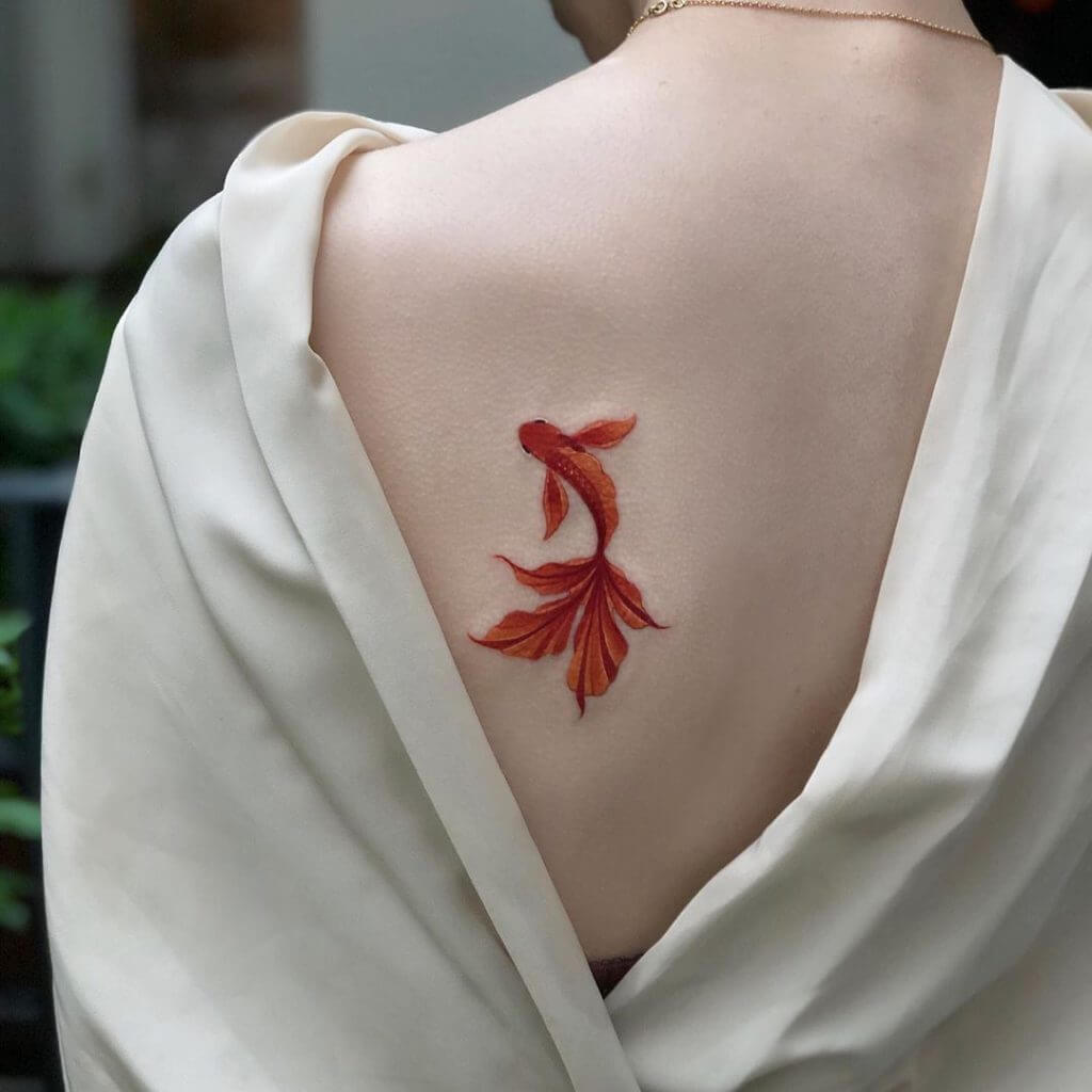 Color Animal tattoo of a Koi fish on the back