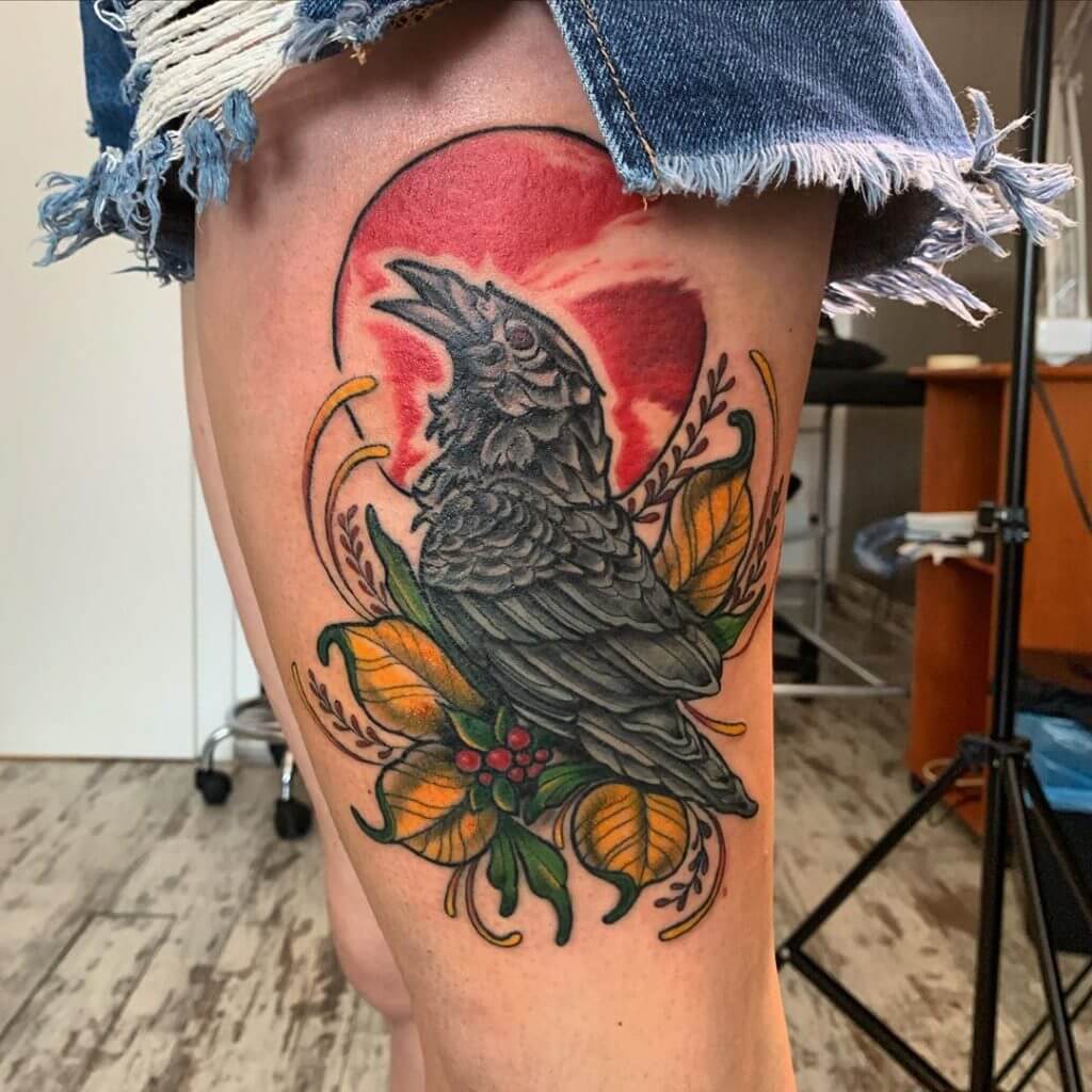 Neo traditional tattoo for woman of a crow on the left thigh