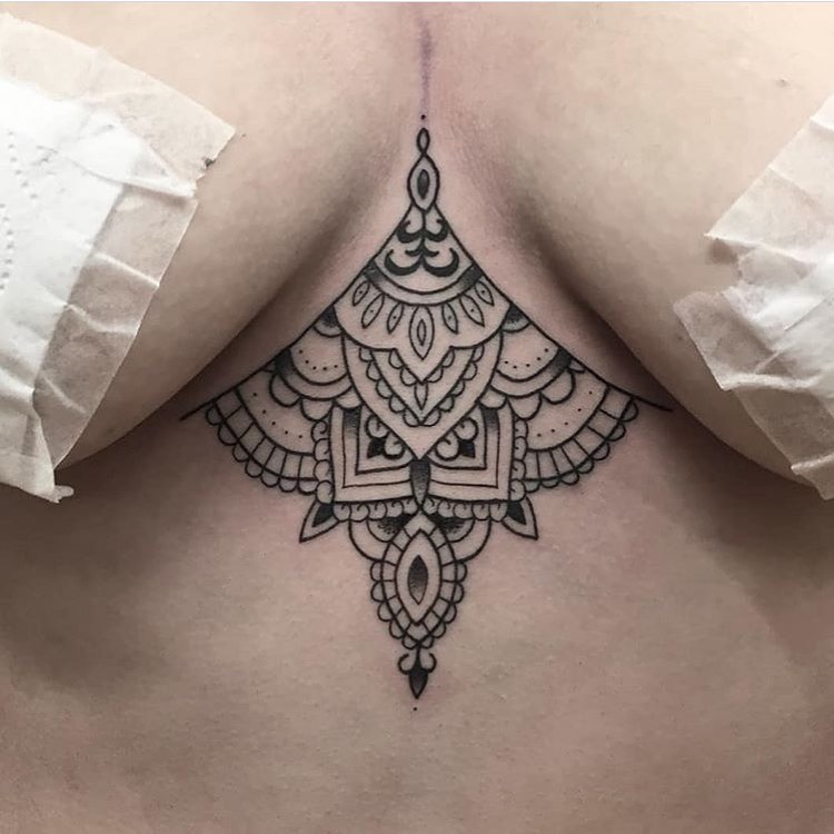Neo traditional black tattoo for woman on the chest