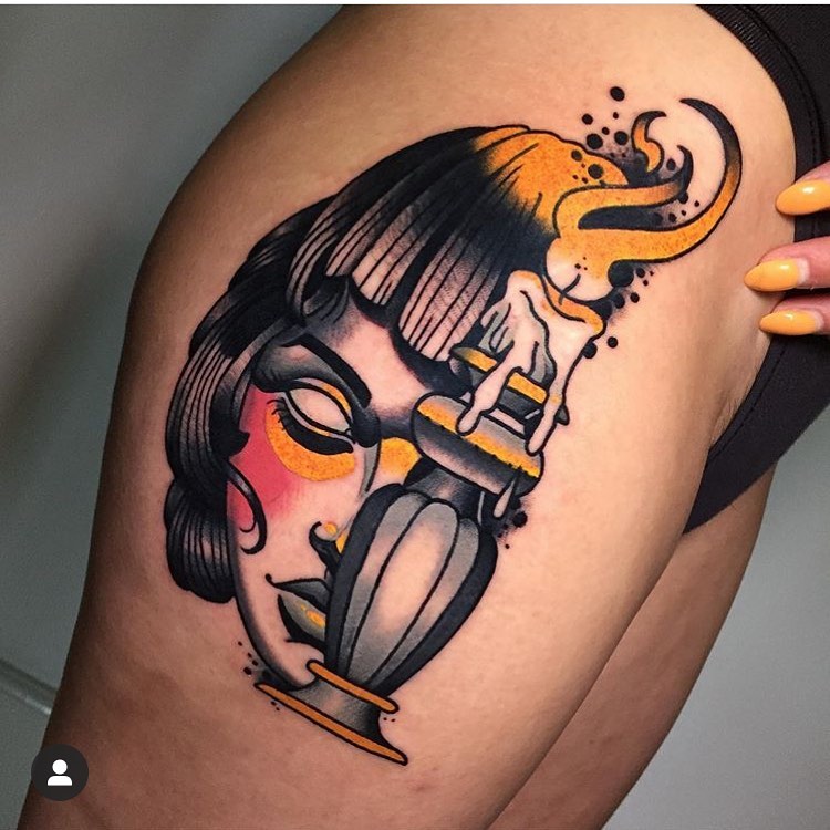 Neo traditional color tattoo for woman of a female face with candle on right thigh