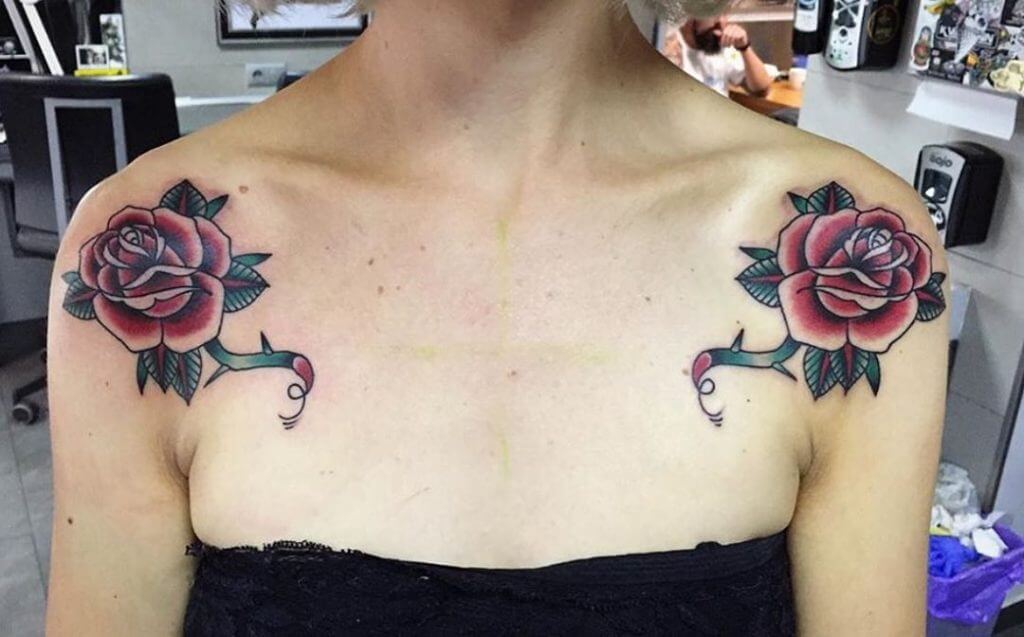 Neo traditional color tattoo for woman of red rouses on the shoulders