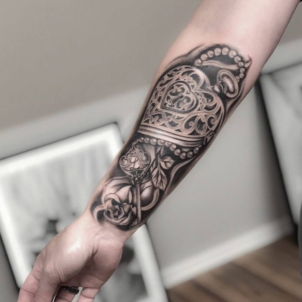 Mens black and gray neotraditional tattoo on the right forearm