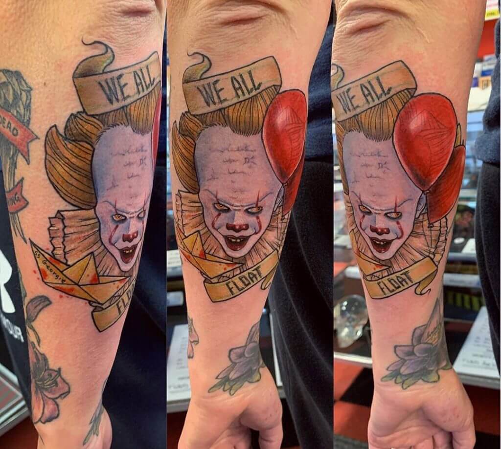 Mens color neotraditional tattoo of a clown with red balloons on the left forearm