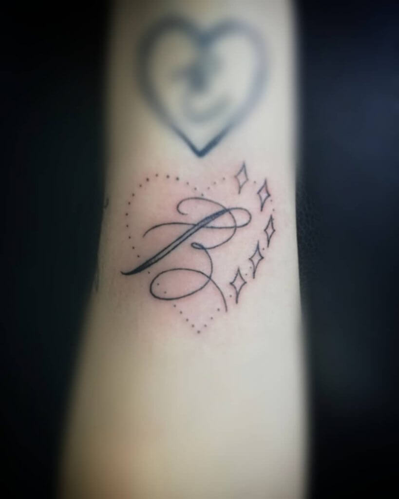 Lettering tattoo for women of letter "B" on the forearm