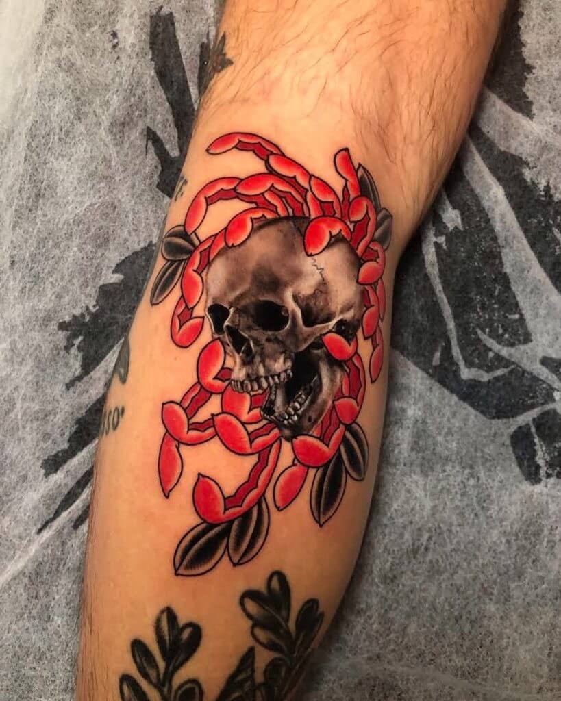 Black and color neotraditional tattoo with a skull in the flower on left calf
