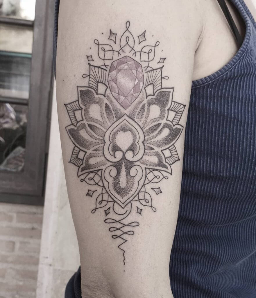Women black and gray mandala dotwork tattoo on the right arm