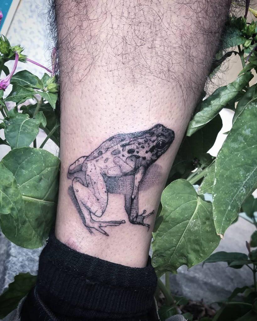 Men black and gray dotwork tattoo of a frog on the left foot
