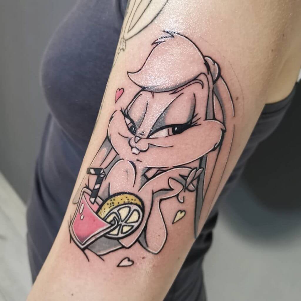 Women color cartoon tattoo of Lola bunny with a lemonade on the left arm