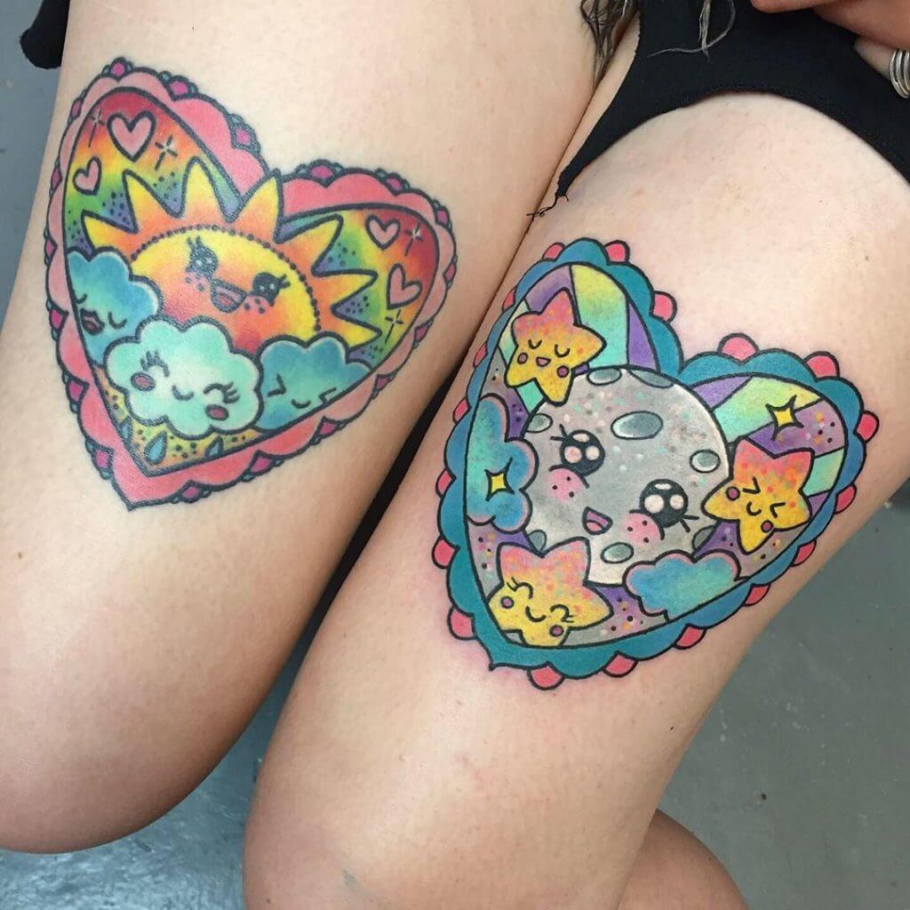 Women color cartoon tattoo of the sun and the moon on both thighs