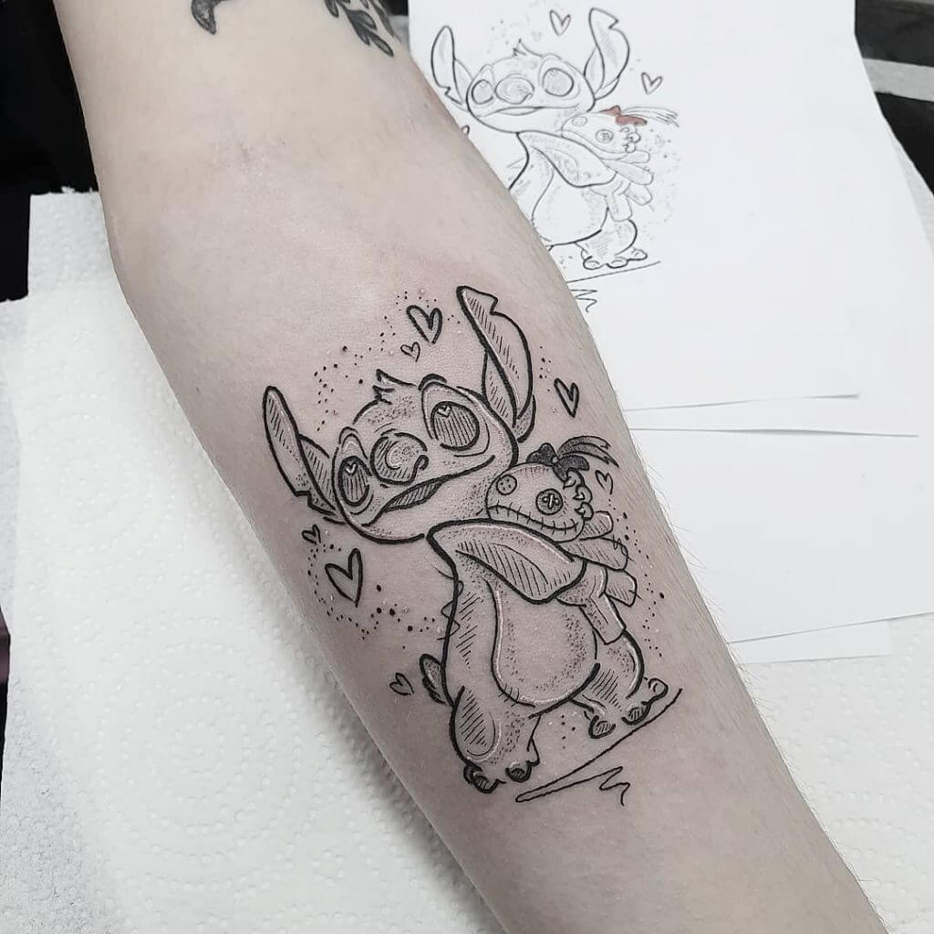 Women black dotwork tattoo of Stitch on the left forearm