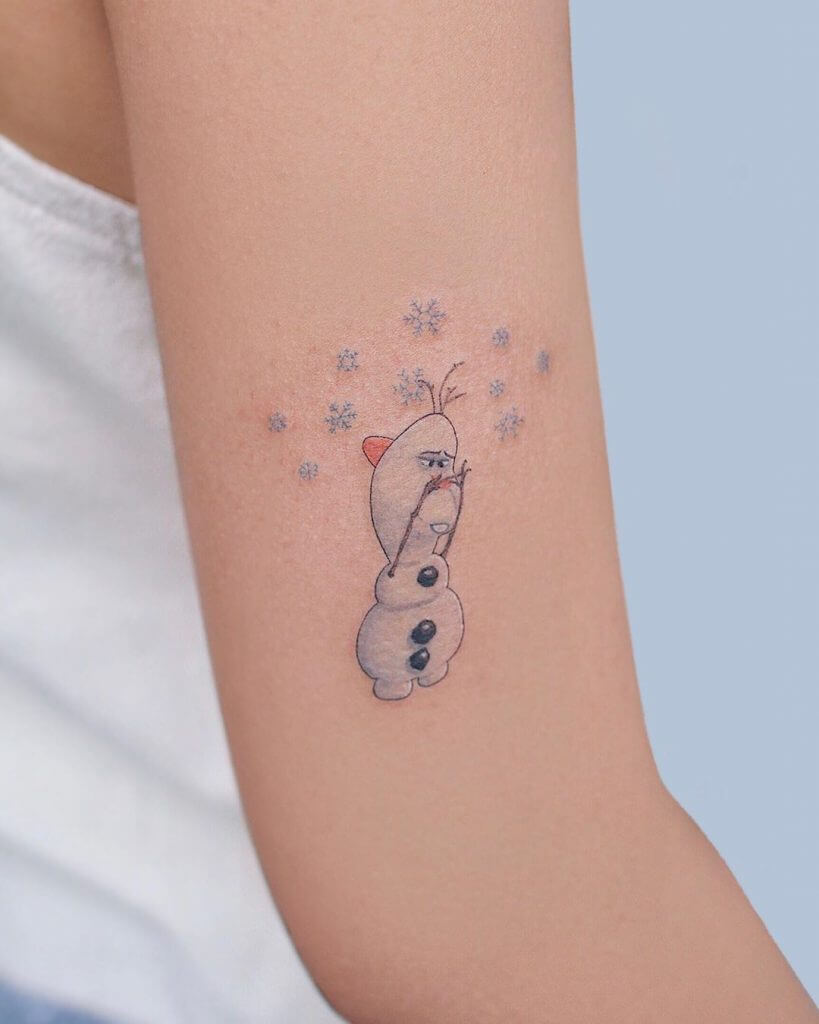 Women color cartoon tattoo of Olaf on the right arm