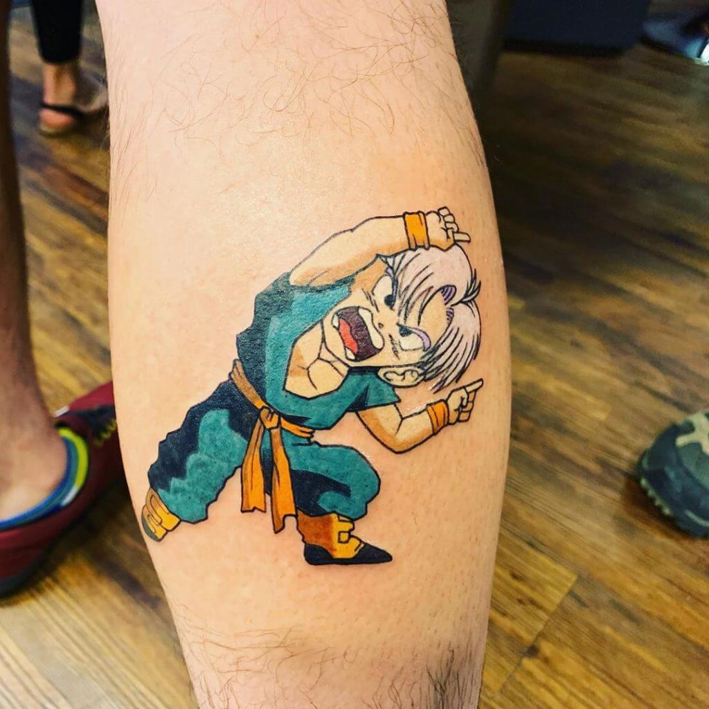 Color cartoon tattoo for men of dragon ball character on the right calf