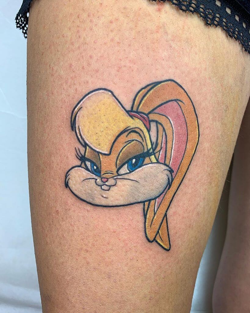 Women color cartoon tattoo of Lola bunny on the right thigh