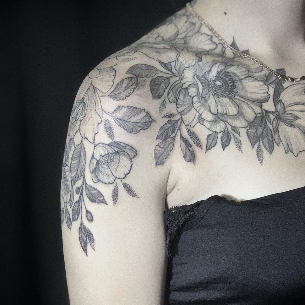 Women black dotwork tattoo of flowers on the right shoulder