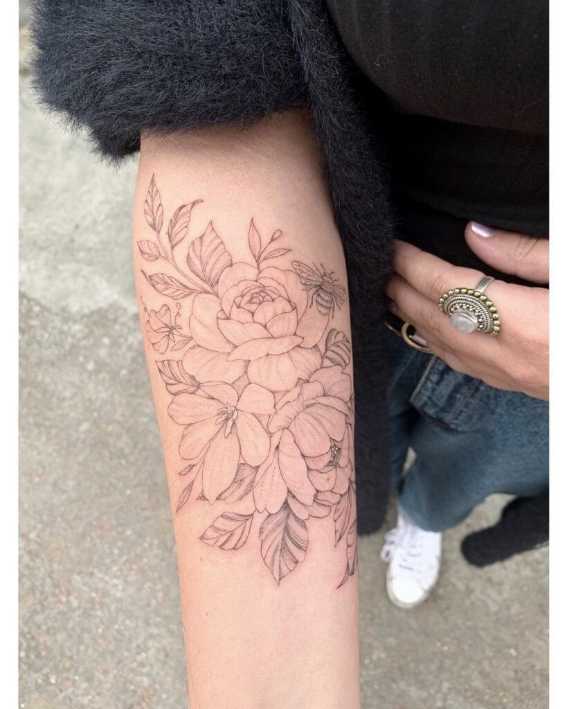 Women black dotwork tattoo of roses on the right forearm