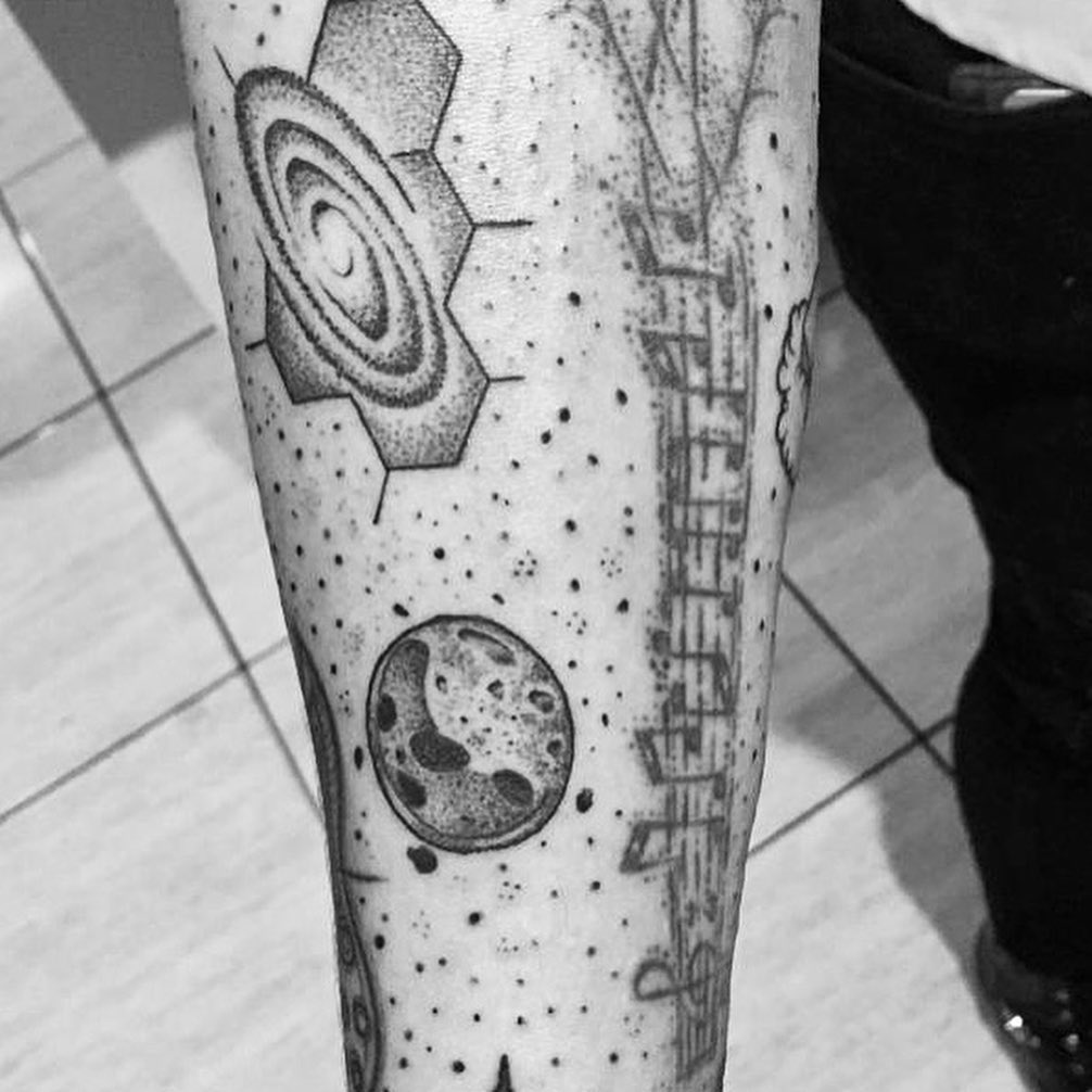 Men black dotwork tattoo of the universe on the right forearm