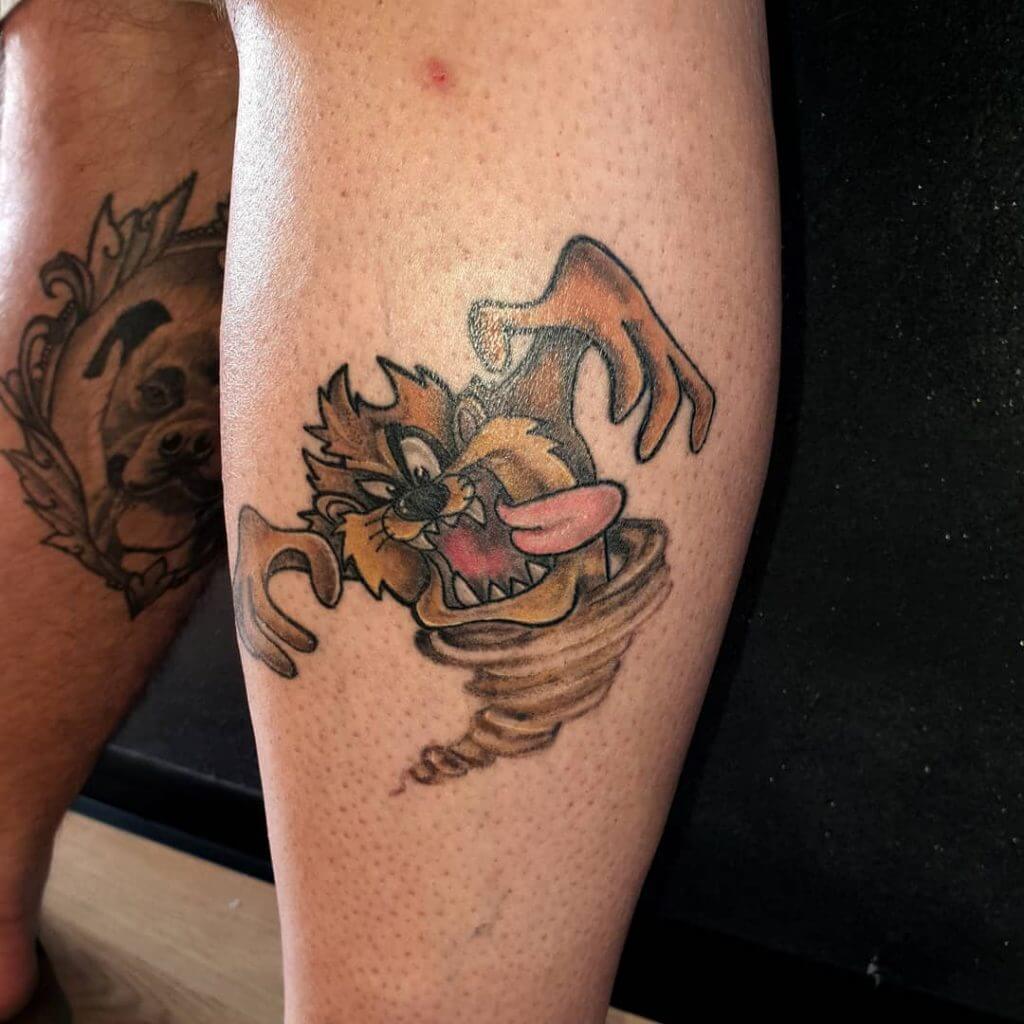 Mens cartoon tattoo of Tasmanian devil on the right calf