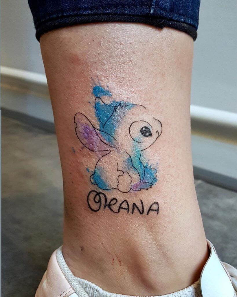 Women watercolor cartoon tattoo of Stitch on the foot