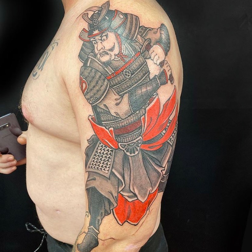 Samuraj tattoo on the left arm