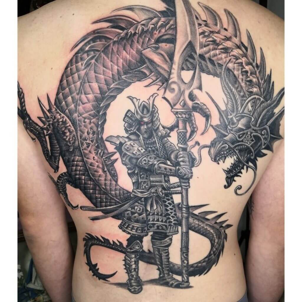 Black and gray Samurai tattoo with a dragon on the back